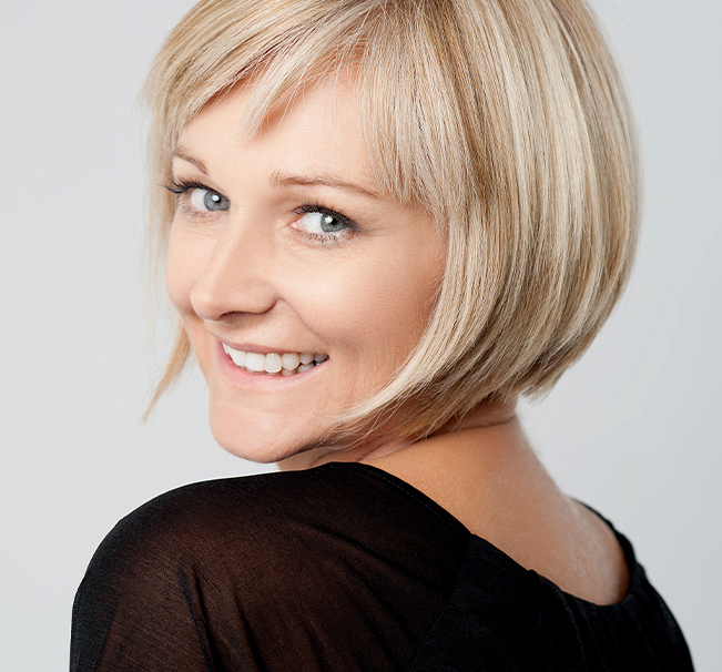Woman receiving RF skin tightening on chin to improve skin firmness after weight loss from GLP-1 medication.