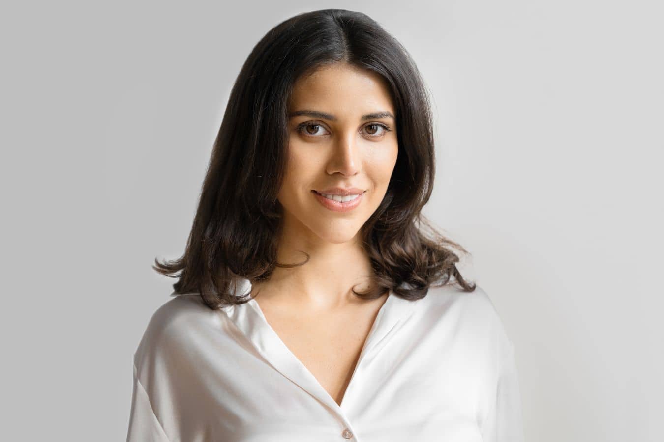 Woman with smooth skin representing dermal filler treatments tailored for prevention, enhancement, and facial volume restoration.